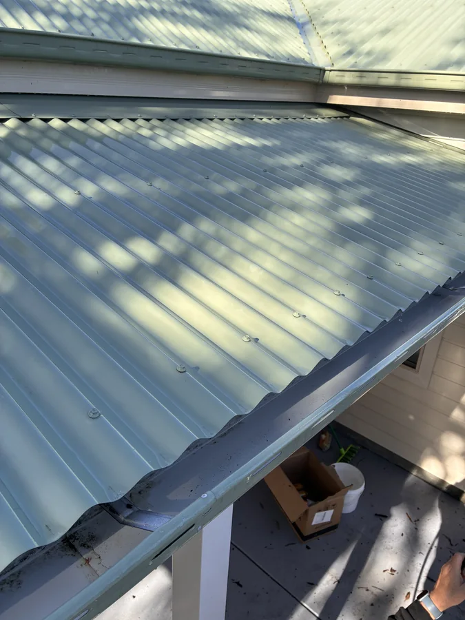 Metal roof and guttering after exterior cleaning
